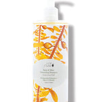 100% Pure Kelp & Mint Volumising Shampoo in a clear bottle of pale golden liquid, with a white pump, golden kelp imagery and a pale green round label.