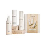 Three LAMAV Hydration Skin Discovery Pack products are showcased on stone blocks against a white background. This essential trio features hydrating formulas with hyaluronic acid for naturally radiant skin.