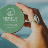 SunButter Protective Hair Serum held in hand