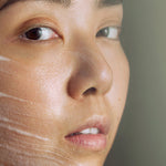 Model wearing Madara Peel Brightening AHA Peel Mask