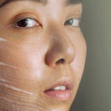 Model wearing Madara Peel Brightening AHA Peel Mask