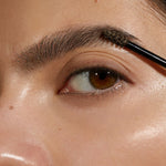 Model wearing Madara Grow and Fix Tinted Brow Gel in Ash Brown