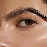 Model wearing Madara Grow and Fix Tinted Brow Gel in Ash Brown