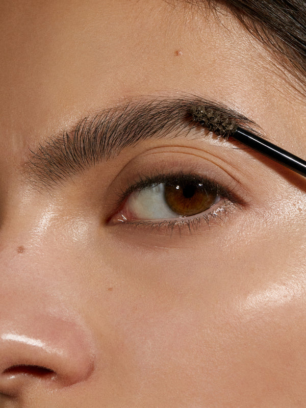 Model wearing Madara Grow and Fix Tinted Brow Gel in Ash Brown
