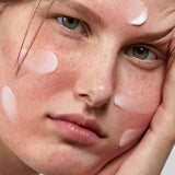 Model applying Madara SOS+ Sensitive Night Cream