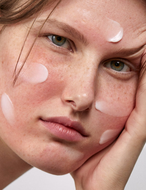 Model applying Madara SOS+ Sensitive Night Cream