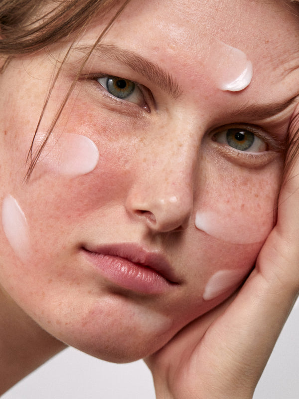 Model applying Madara SOS+ Sensitive Night Cream