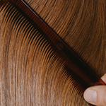 Model with smooth hair after Madara Silk Micro-Keratin Hair Mist