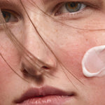 Model applying Madara SOS+ Sensitive Moisturiser