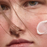 Model applying Madara SOS+ Sensitive Moisturiser