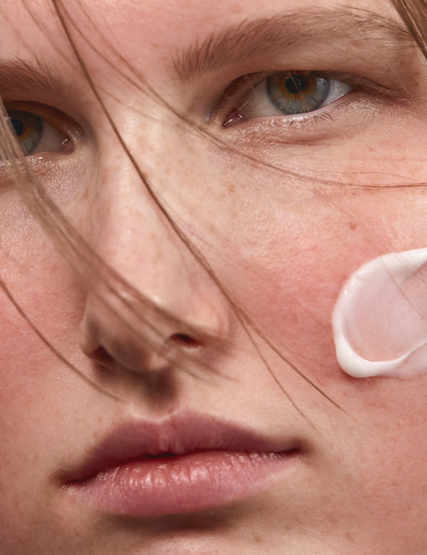 Model applying Madara SOS+ Sensitive Moisturiser