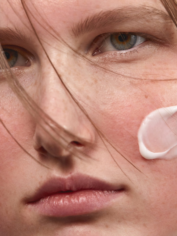 Model applying Madara SOS+ Sensitive Moisturiser