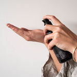 Dispensing Mukti Balancing Cleansing Gel from the pump bottle onto fingertips