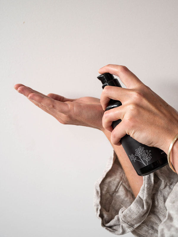 Dispensing Mukti Balancing Cleansing Gel from the pump bottle onto fingertips