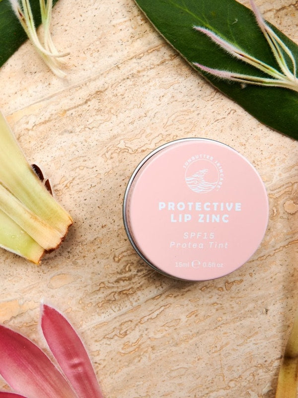 SunButter Protea Tint Protective Lip Zinc styled with flowers