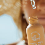SunButter Nourishing Face Oil being applied