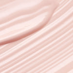 Close-up of pale pink Kakadu Plum Vitamin C Eye Cream spread into smooth diagonal ridges and glossy folds.