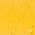 Golden oil texture of KORA Organics Noni Glow Body Oil