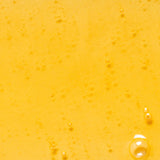 Golden oil texture of KORA Organics Noni Glow Body Oil