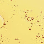 Golden oil texture of KORA Organics Noni Glow Face Oil