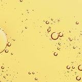 Golden oil texture of KORA Organics Noni Glow Face Oil