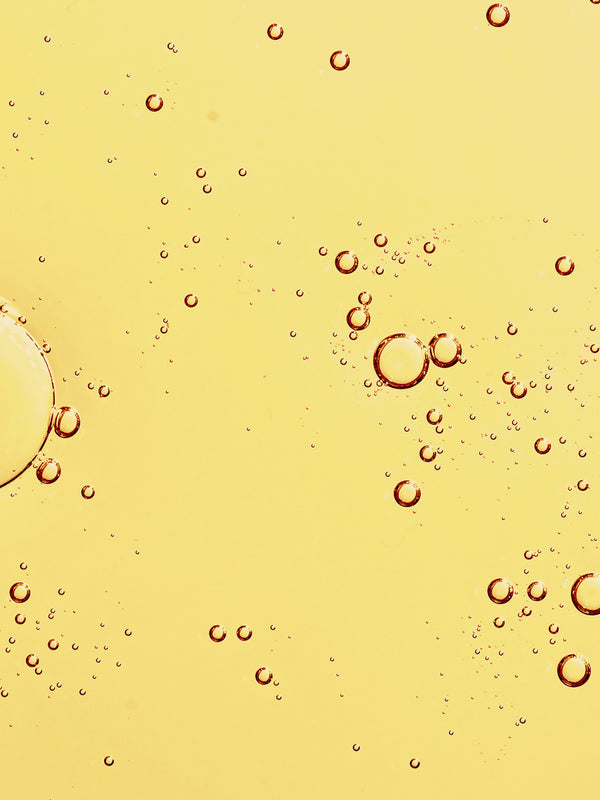 Golden oil texture of KORA Organics Noni Glow Face Oil