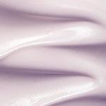 Close-up of pale lilac Plant Stem Cell Retinol Alternative Moisturiser spread into thick, smooth waves with glossy ridges.
