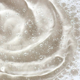Golden gel texture of KORA Organics Turmeric Glow Foaming Cleanser