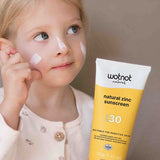 Child applying Wotnot Natural Family Sunscreen SPF 30