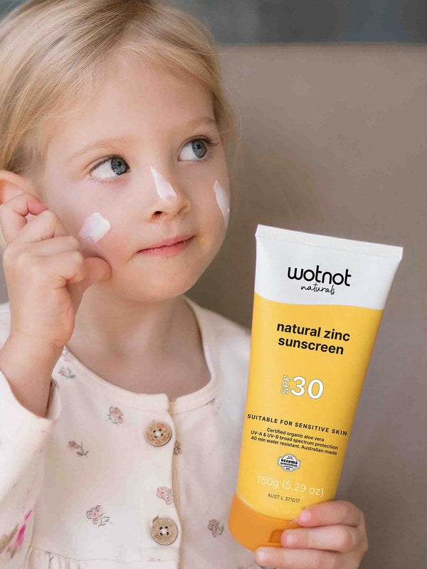 Child applying Wotnot Natural Family Sunscreen SPF 30