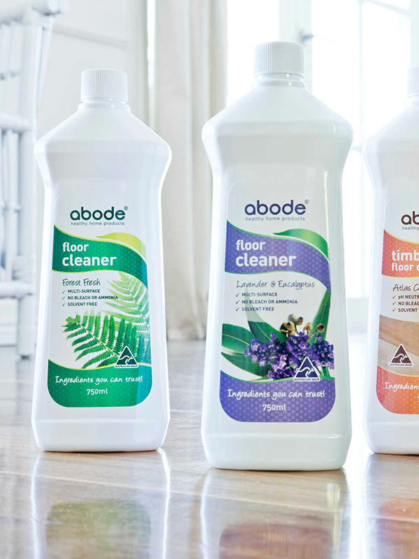 Set of three Abode floor cleaners including Timber Floor Cleaner Atlas Cedar on a timber floor