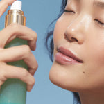 Model spraying KORA Organics Minty Mineral Hydration Mist on her face