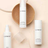Three LAMAV Hydration Skin Discovery Pack products are displayed on a beige surface with a tan ceramic dish, featuring three essentials for ultimate hydration from LAMAV.