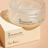 Ere Perez Fig All-Beauty Jelly open jar resting on its box against a peach background