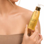 Woman holding The Jojoba Company Jojoba Activating Cleansing Oil