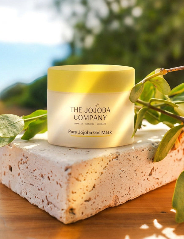 The Jojoba Company Pure Jojoba Gel Mask jar on a stone surface with greenery