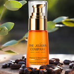 The Jojoba Company Vitamin C Glow Potion bottle with gold pump and clear cap