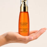 Open hand holding a bottle of The Jojoba Company Vitamin C Glow Potion