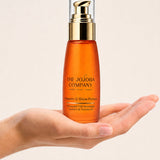 Open hand holding a bottle of The Jojoba Company Vitamin C Glow Potion