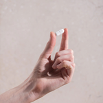 Hand holding a Herbs of Gold Magnesium Forte tablet