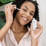 Model applying Raww Superfood Crystal Glow Serum