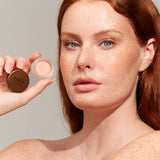 Model wearing INIKA Organic Lip and Cheek Cream