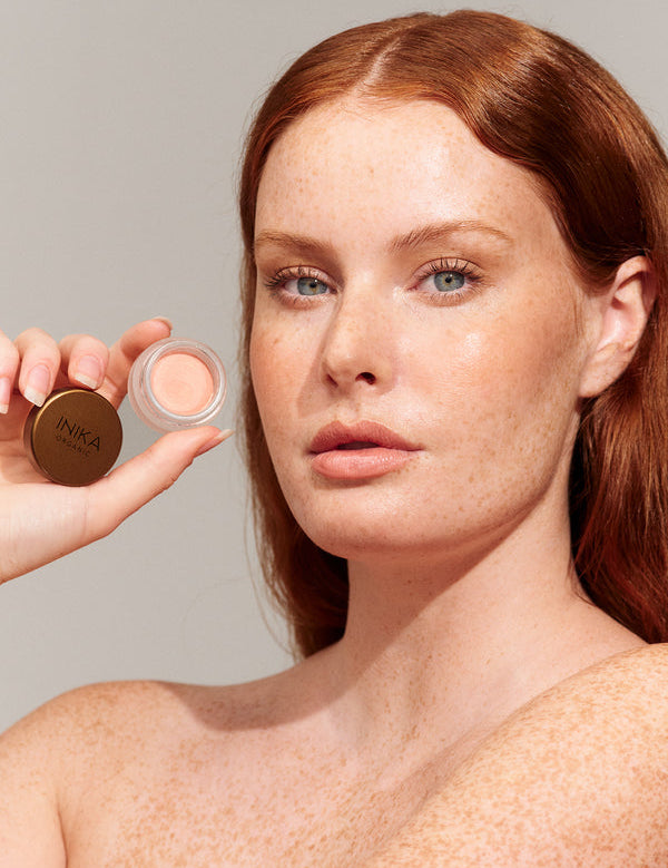 Model wearing INIKA Organic Lip and Cheek Cream