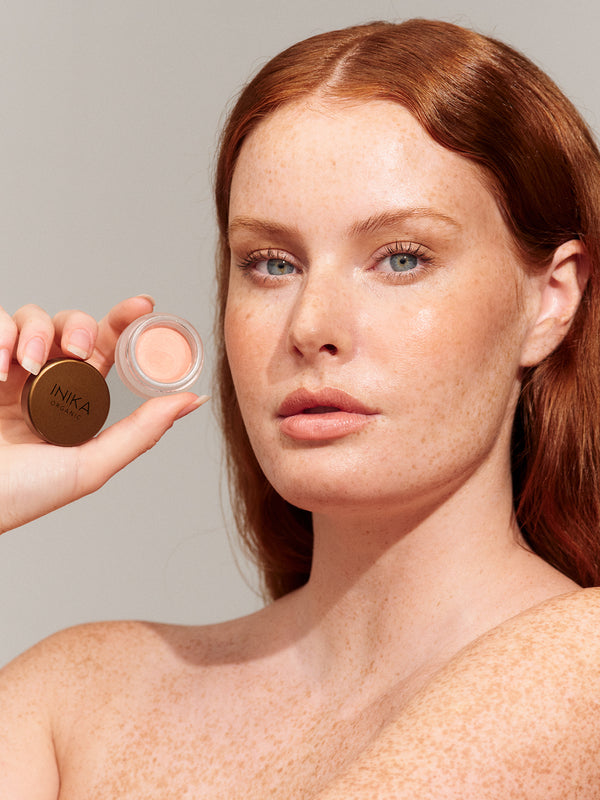 Model wearing INIKA Organic Lip and Cheek Cream