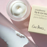 Ere Perez Cranberry Lip and Eye Mask open jar, box and creamy swatch on a pink background