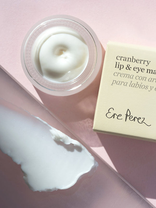 Ere Perez Cranberry Lip and Eye Mask open jar, box and creamy swatch on a pink background