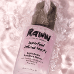Model applying Raww Light Beam Radiance Serum