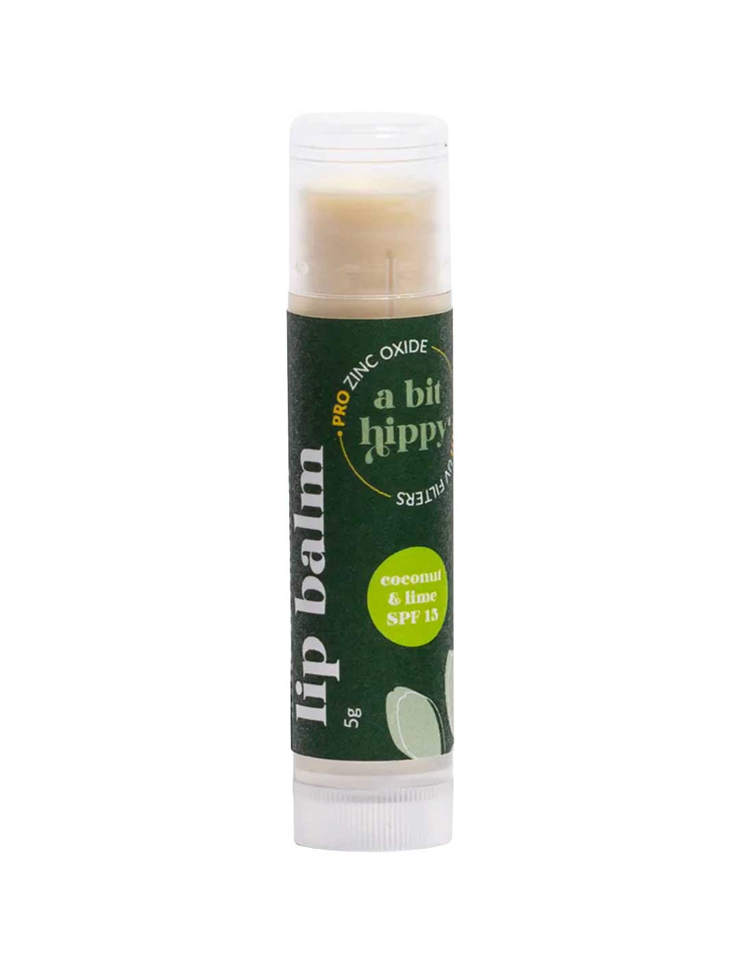 A Bit Hippy Coconut & Lime Lip Balm SPF 15 (5g) comes in a clear plastic tube with a green label featuring white and yellow text. This vegan lip balm contains pro-zinc oxide for protection and is easy to use on the go.