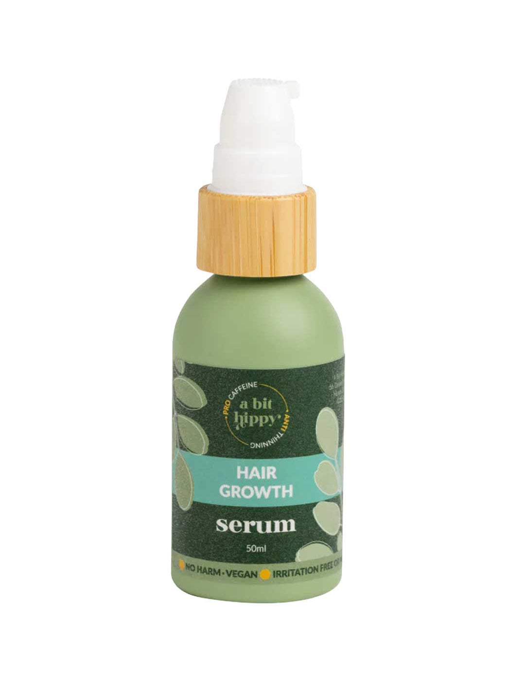 A Bit Hippy Hair Growth Serum 50ml comes in a green bottle with a pump and wooden-look collar. The label notes it's vegan, gentle on skin, and caffeine-infused.
