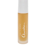A small frosted glass bottle (10ml) with a white cap, filled with yellow serum. The label reads Salt + Glow Awaken Coffee Eye Serum—a blend with coffee and hyaluronic acid to help reduce dark circles and hydrate.